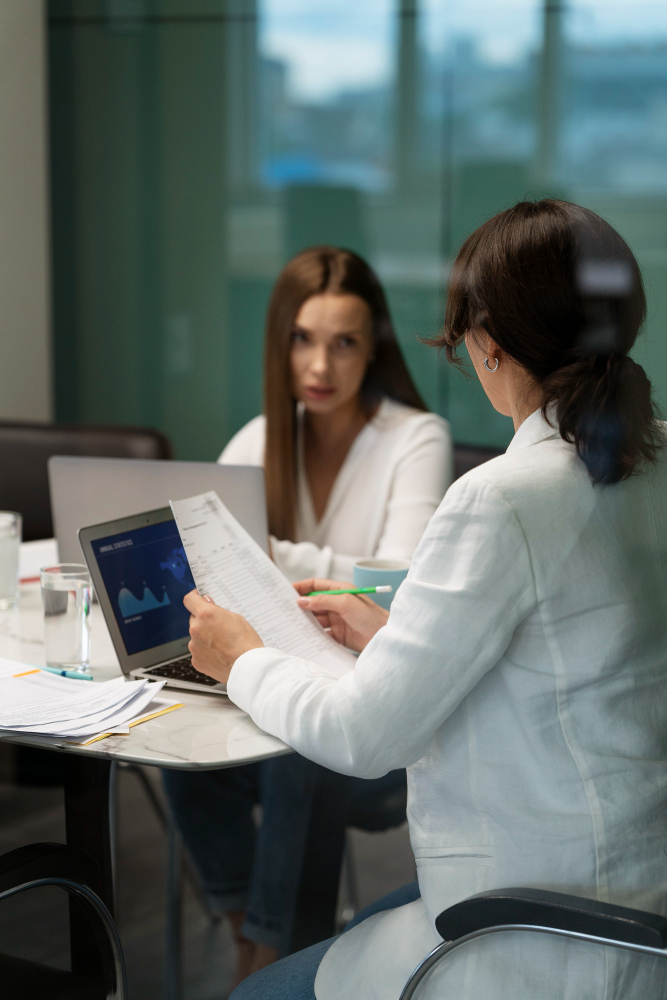Consultant reviewing practice performance with a physician